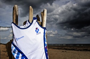 The white KUKRI Scotland vest for Glasgow 2014 flutters on St Andrews beach