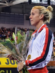 Lynsey Sharp clutches European Championship gold medal and flowers at Emirates Arena in January 2014